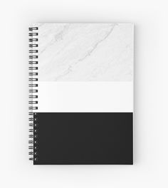 a spiral notebook with black and white stripes