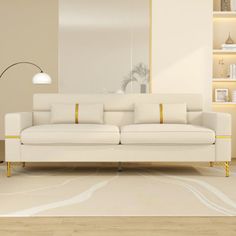 a living room with a white couch and book shelves on the wall next to it