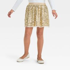 Spruce up their fancy wardrobe with this Sequin Party Skirt from Cat & Jack™. The above-knee party skirt is crafted from recycled polyester mesh fabric with a full lining and full elastic waistband for a comfortable fit. It features an allover sparkly sequin design in gold, making it a great pairing with any of their favorite party tops. Cat & Jack™: Designed for all children so you can trust it's made for yours. Stretch Tulle Bottoms For Party, Spring Party Skirt With Elastic Waistband, Fitted Party Skirt With Elastic Waistband, Fitted Skirt With Elastic Waistband For Party, Fitted Tulle Skirt For Dress-up, Holiday Stretch Mini Skirt, Stretch Mini Skirt For The Holiday Season, Stretch Mini Skirt For Holiday, Spring Tulle Skirt For Dress-up