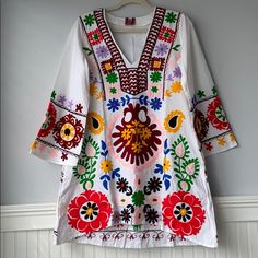 New Boho Tunic Handmade Embroidered Mini Dress 100% Cotton Super Cute!!! *100% Cotton Shift Dress *Super Cute, Gypsy, Boho Dress #Boho #Bougiepeasant #Peasant Bohemian Boho Style Only Small/Medium Left L/Xl Pit To Pit 21”, Top To Bottom 32” Traditional V-neck Embroidered Dress, Multicolor Folk Style V-neck Dresses, Spring Folk Kaftan With Multicolor Embroidery, Spring Traditional Embroidered V-neck Dress, Traditional Embroidered V-neck Dress For Spring, Traditional Spring Embroidered Dress With V-neck, Red Bohemian Embroidered Dress With V-neck, Floral Embroidered V-neck Festival Dress, Traditional V-neck Embroidered Dress For Spring