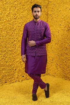 Purple bundi with geometric woven motifs and front buttons. Comes with kurta and woven churidar.
Component: 3
Pattern: Woven
Type Of Work: Geometric
Neckline: Band
Sleeve Type: Full Sleeves
Fabric: Banarasi Chanderi, Glace Cotton
Color: Purple
Other Details: 
Woven pant
Patch pocket
Front buttons
Occasion: Sangeet - Aza Fashions Kurta Bandi For Men, Designer Nehru Jacket With Dabka For Festivals, Navratri Long Sleeve Kurta With Woven Motifs, Wedding Kurta With Woven Motifs For Transitional Season, Transitional Wedding Kurta With Woven Motifs, Designer Nehru Jacket With Zari Work For Diwali, Straight Chanderi Kurta With Woven Motifs, Chanderi Straight Kurta With Woven Motifs, Fitted Kurta With Woven Motifs For Transitional Season