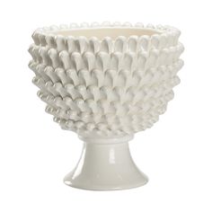 a white ceramic bowl sitting on top of a table