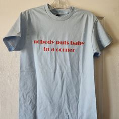 "Nobody Puts Baby In A Corner" Tee Shirt Brand: Gildan Tee Shirt, But Self Made Size: Small Color: Baby Blue With Red Lettering Condition: New (Did Not Come With Price Tag) Material: Cotton Custom T Shirts For Women - Added My Personalized Text - I Made A Small And Medium And The Medium Fit Me Better. See Pictures For Measurement. Self Made, Shirts For Women, Custom T Shirts, Text Me, Shirt Brand, Price Tag, Custom Tshirts, Baby Blue, Tee Shirt