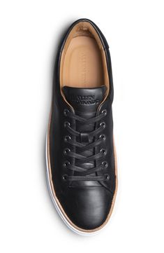 Minimal styling gives work-to-weekend versatility to this elevated sneaker designed for all-day comfort and great durability. Round toe Lace-up style Leather upper, rubber sole Imported Low-top Work Sneakers With Rubber Sole, Everyday Lace-up Sneakers With Abzorb Midsole, Black Plain Toe Sneakers For Work, Low-top Everyday Sneakers With Abzorb Midsole, Black Leather Sneakers For Workwear, Low-top Sneakers With Abzorb Midsole For Everyday, Black Sneakers With Gum Sole For Everyday, Casual Round Toe Sneakers For Work, Modern Black Sneakers For Work