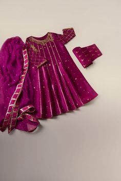 An ethereal three piece on pure cotton net in an Anarkali silhouette with heavy zardosi gotah work in rich tone of hot pink, revamp your festive look in this beautiful three piece. Delivery time: 4 to 6 weeks Pink Dori Work Sets For Eid, Anarkali Sets With Dupatta For Festive Occasions, Pink Chinon Sets With Zari Work, Pink Raw Silk Anarkali Set With Dori Work, Pink Chinon Dress With Dabka Work, Fitted Cotton Silk Anarkali For Festive Occasions, Pink Salwar Kameez For Eid, Pink Dori Work Kurta For Party, Anarkali Kundan Sets For Festivals