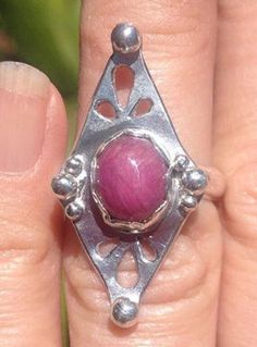 Sterling Silver and Ruby Ring Size 6 - a beautiful cabochon ruby and cut-out details and silver ball embellishments. Cabochon Ruby, Asheville Nc, Ruby Ring, Asheville, Embellishments, Ruby, Cut Out, Ring Size, Size 6