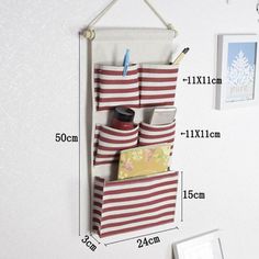 a wall hanging organizer is shown with the measurements