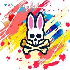 a rabbit skull and crossbone with paint splattered on it's face