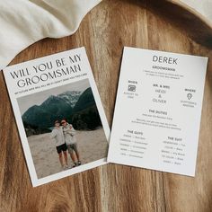 two brochures sitting on top of a wooden table next to a white towel