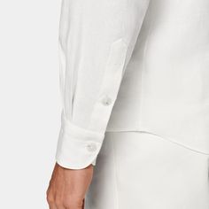 This casual white shirt is tailored to a relaxed fit, and features a single cuff and classic collar. White Collared Business Shirt, Timeless Summer Shirt With Spread Collar, Timeless Shirt With Button Cuffs And Relaxed Fit, White Cotton Shirt With Concealed Placket, Elegant Shirt With Welt Pockets And Spread Collar, White Shirt With Placket For Work, White Shirt With Concealed Placket For Summer, Modern White Dress Shirt For Semi-formal Occasions, Casual White Shirt With Lapel Collar