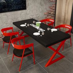 a black table with red chairs around it