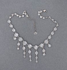 "Exquisite and RARE vintage Christian Dior dangle drop necklace. Dazzling Swarovski crystal stones are gracefully hanging down with spectacular fashion and movement. They are point back, set in an open setting of white metal (rhodium plate, or?) Has a secure claw fastener with a 2-1/4\" extender chain to adjust the length. GORGEOUS! (my camera refuses to capture all the brilliance, fire, and clarity of these amazing stones.... SOOOO much prettier in person! Such a rare find.... the first I have Luxury Crystal Drop Necklace, Elegant Drop-shaped Crystal Rhinestone Necklace, Elegant Crystal Dangle Drop Necklace, Elegant Crystal Drop Dangle Necklace, Elegant Rhinestone Necklaces, Crystal Rhinestone Dangle Necklace, Juliana Jewelry, Vintage Christian Dior, Purple Orchids