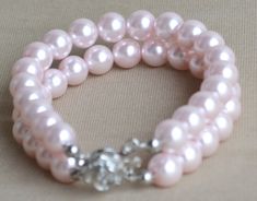 I make the bracelet to use 8mm pale pink glass pearls.The bracelet lengh is 7.5inchesinches wrist,IT has a 2 inches long adjustable chain.IT is good bracelet for your great wedding. I can make different type bracelet to your requirements,Please feel free to contact me if you have any question. Thank you so much. . Bridesmaid Pearl Bracelet, Pearl Bridesmaid Jewelry, Pearl Bracelet Jewelry, Pink Pearl Bracelet, Grey Pearl Necklace, Pearl Bracelet Wedding, White Pearl Bracelet, Ivory Earrings, Black Pearl Necklace