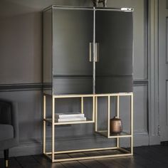 a black and gold cabinet in a living room