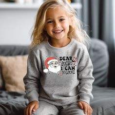 "Dear Santa Kids Shirt, Toddler Christmas Sweatshirt, Christmas Bodysuit, Christmas Shirts, Merry Christmas Kids Shirt, Cute Santa Kids Shirt HOW TO ORDER * Please review all the information provided before placing an order. 1. Select the style and size using the drop-down menu. 2. Select color 3. [APPLICABLE ONLY ON CERTAIN LISTINGS] Follow the instructions to fill out the \"Add your personalization\" option, e.g., specifying custom sayings or selecting design colors. 4. Select quantity Need more Items? Add the current item to the cart. And if you like to add more items to your order, please press the back button and repeat steps again. 5. Once all your desired items are in your cart you may complete your order by entering your payment method, desired shipping address and click submit. GA Xmas Outfit, Christmas Shirts For Kids, Girl Shirts, Xmas Tees, Boo Crew, Toddler Christmas, Halloween Shirts, Holiday Sweatshirt, Toddler Hoodie