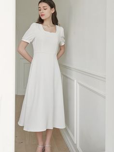 This is a minimal and feminine dress by MICANE that is made out of high quality and sturdy fabric. With trendy design detail and refined mood, you can style it for your refined and casual daily outfit.- Minimal and feminine mood- Square neckline with heart line detail- Sleeves shirring detail Feminine Midi Dress With Flattering Silhouette, Elegant Solid Midi Dress For Daywear, Elegant Dresses With French Seams For Daywear, Chic Midi Dress With French Seams, Elegant Dresses With French Seams, Chic Plain Midi Dress, Feminine Square Neck Dress For Work, Classic Midi Dress With French Seams, Chic Fitted Plain Midi Dress