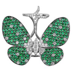 Featuring a playful butterfly motif set with round cut diamonds and green sapphires. Amwaj charming ring captures the beauty of butterfly wings created in shining rows of diamonds and sapphires set in 18 Karat white gold, each of stone has been independently cut to fit the curvy design. - Weight: 20.640 g - Diamond: 1.780 cts - Sapphires: 6.240 - Color & clarity: GH Color VS/SI Gold Butterfly Ring, Butterfly Motif, Butterfly Ring, Green Sapphire, Gold Butterfly, Butterfly Wings, Sapphire Diamond, Round Cut Diamond, Cocktail Rings