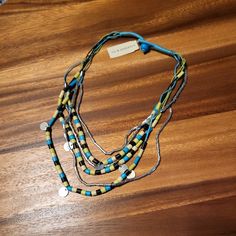 Nwt Stephan & Co. Multi-Layer Boho Bead And Cord Necklace. Kitschy Eclectic Bohemian Summer Camp Vibes. Mixed Materials And Multiple Layers Necklace. Never Worn, Still Has Tags On It, But It's Been Stored Over The Years And Shows Some Storage Wear/Dirt/Mark. Overall Still In Good Condition, Could Probably Be Cleaned Up. Colorway Of Black, Yellow, Blue And Silver. Mixes Beads With Cord/String For A Cool Look. Great For Work To Evening. Summer Camp Vibes, Lion Head Bracelet, Wire Choker Necklace, Multi Layer Necklace Beads, Wrap Choker Necklace, Pearl Rope, Shell Beads Necklace, Horse Bracelet, Camp Vibes