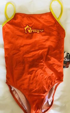 *****ROXY TEENIE WAHINE CHILDREN'S SIZE 12****   BRAND NEW WITH TAGS ROXY GIRL'S ONE PIECE RETRO SWIMSUIT. SIZE: 12 (CHILDREN'S SIZE ) COLOR ORANGE  WITH YELLOW TRIM SUIT :  FULLY LINED. ROXY IS WRITTEN ACROSS THE FRONT WITH A ROXY LOGO THE SUIT BUCKLES IN THE BACK MACKING A CIRCLE CUTOUT  BODY: 80% NYLON, 20% SPANDEX Track Page Views With Auctiva's FREE Counter Roxy Logo, Roxy Girls, Yellow Trim, Retro Swimsuit, Swimsuit Set, A Circle, Roxy, Color Orange, Tankini