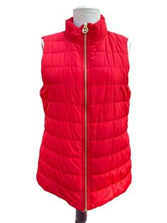 Elevate your winter and fall wardrobe with this vintage Michael Kors Quilted Puffer red jacket vest. The vest features a full zip closure, red lined interior, and multiple pockets for added convenience. The classic fit makes it suitable for both travel and casual occasions. Crafted with quality materials and designed with attention to detail, this vest is perfect for women who want to stay warm and stylish. The accents of the zipper add a touch of designer flair to the overall look. This vest is Puffer Jacket Vest, Zip Up Vest, Red Vest, Red Quilts, Quilted Puffer Jacket, Jacket Vest, Vest Outfits, Fall Wardrobe, Puffer Jacket