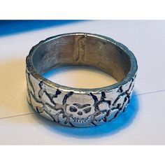 "\"Sterling Silver 925 Wide Band Ring with Intricate Crackling Detail & Skull Center, Size 8\" Description: Elevate your style with this striking Sterling Silver 925 Wide Band Ring featuring exquisite crackling detail and a captivating skull centerpiece. Crafted with precision and finesse, this ring exudes an aura of mystery and boldness, perfect for those with a taste for the extraordinary. The crackling detail adds a touch of dynamic texture, while the intricately designed skull in the center adds an edgy yet sophisticated charm. Each element is meticulously crafted to ensure durability and long-lasting shine. This ring is hallmarked 925, guaranteeing its authenticity and quality. With a weight of 2.7 grams, it offers a comfortable fit for everyday wear without compromising on style. Whe Adjustable Sterling Silver Skull Ring, Skull Shaped Symbolic Jewelry Stamped 925, Symbolic Skull Shaped 925 Stamped Jewelry, Silver Adjustable Symbolic Skull Ring, Silver Symbolic Skull Ring, Symbolic Silver Skull Ring, Sterling Silver Skull Ring Stamped 925 For Promise, White Gold Round Skull Ring Stamped 925, Engraved White Gold Skull Ring In Sterling Silver