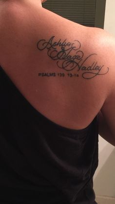 the back of a woman's shoulder with an inscription that reads, happy holidays