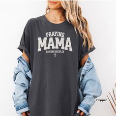 This Praying Mama Comfort Colors Shirt has a distressed text for a trending look and you're going to love the feel of this high quality shirt you'll enjoy wearing it over and over again as you show your devotion to God! -Unisex Comfort Colors T-shirt -The soft-washed, garment-dyed fabric brings extra coziness to your wardrobe while the relaxed fit makes it an excellent daily choice.  -100% ring-spun cotton -Medium fabric  -Relaxed fit -Depending on what device you are viewing this listing on, co Raising Disciples, Grunge Text, Homeschool Gifts, Christian Homeschool, School Mom, Oversized T Shirt Dress, Teacher Mom, Mama Tee, Comfort Colors Shirt