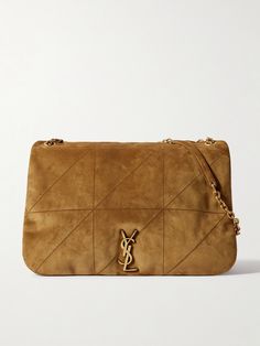 When you invest in a SAINT LAURENT bag, you take home a small piece of the maison's illustrious legacy. This 'Jamie' style has been crafted in Italy from supple quilted suede and embellished with the unmistakable 'YSL' logo. The gold-tone chain strap has a generous drop, so it'll slip comfortably over your shoulder, while the spacious interior boasts plenty of space for a continental wallet, makeup kit, tablet and water bottle. Investment Bags, Small Shoulder Bags, Suede Bag, Bag Obsession, Flat Dress Shoes, Chain Strap Bag, Fine Jewelry Designers, Saint Laurent Bag, Makeup Kit