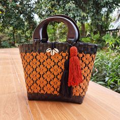 Introducing our handmade Thai straw bags, crafted with love and care by skilled artisans in Thailand. Each bag is made from high-quality, sustainable materials and features a beautiful woven design that is unique to each piece. The first thing you'll notice about our bag is the handcrafted wooden handle from Chiangmai. Made by skilled artisans using locally sourced wood, the handle adds a touch of rustic elegance to the design. It's both comfortable to hold and visually striking, making it the p Eco-friendly Palm Leaf Bag With Open Weave, Eco-friendly Rectangular Open Weave Straw Bag, Black Woven Beach Bag Made Of Natural Fiber, Traditional Shoulder Bag With Bamboo Handle, Eco-friendly Handwoven Natural Crochet Bag, Eco-friendly Bucket Bags With Bamboo Handle, Eco-friendly Rectangular Beach Bag With Braided Handles, Eco-friendly Crochet Bag With Bamboo Handle, Eco-friendly Crochet Bucket Bag With Bamboo Handle