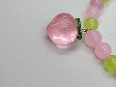 Made with 8 mm natural pink and green chalcedony beads and a resin peach charm. Bracelets are made with stretchy elastic string to fit more sizes. Due to the nature of bracelets handmade with natural crystal beads, some variation in color/sizing/design is to be expected. If you like this bracelet, and want something similar but slightly different? Just message me and we can discuss a custom listing! Adjustable Pink Charm Bracelet With 8mm Beads, Pink Rose Quartz Stretch Bracelet With 8mm Beads, Pink Beaded Stretch Bracelet For Healing, Pink Rose Quartz Round Stretch Bracelet, Pink Rose Quartz Stretch Bracelet, Adjustable Pink Stretch Bracelet With Gemstone Beads, Pink Hand-strung Charm Bracelet For Gift, Adjustable Pink Gemstone Bead Stretch Bracelet, Peach Round Beads Bracelet As Gift