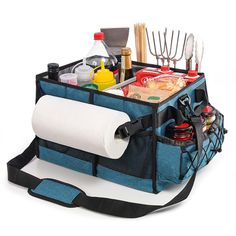 an image of a picnic bag with food and utensils in it