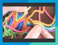 someone is crocheting together with colorful yarn