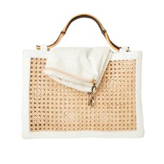 The Reece handbag is the perfect summer stand-out piece! Features distinctive design elements using a unique combination of wicker, lambskin leather, and bamboo handles. Includes a removable inner cotton lining with zipper closure. Product Overview: Materials: Wicker, bamboo, lambskin leather and cotton Size: 10” x 11” Modern Straw Bag With Bamboo Handle For Vacation, Chic Natural Shoulder Bag With Bamboo Handle, Modern Summer Straw Bag With Bamboo Handle, Modern Summer Bags With Bamboo Handle, Modern Natural Shoulder Bag With Bamboo Handle, Luxury Summer Shoulder Bag With Bamboo Handle, Beige Shoulder Bag With Bamboo Handle For Day Out, Luxury Summer Straw Bag With Round Handle, Modern Summer Shoulder Bag With Bamboo Handle