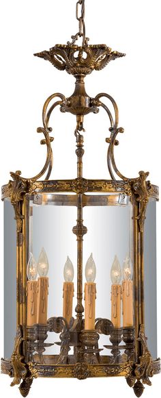 an antique chandelier with four candles in it