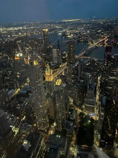 an aerial view of new york city at night from the top of the empire building