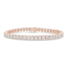 This 10K rose gold tennis bracelet features 42 lab grown round brilliant cut diamonds, each set to enhance the sparkle with additional metal that amplifies the brilliance of the stones. The unique setting ensures that each diamond catches the light, creating an extraordinary display of shimmering beauty. | 5 ct. tw. Lab Grown Diamond Illusion Bracelet | 10K Rose Gold | Size 7.00mm | Helzberg Lab Grown Diamonds Illusion Bracelet, Gold Tennis Bracelet, Stone Cuts, Round Brilliant Cut Diamond, Tennis Bracelet, 10k Gold, Round Brilliant Cut, Brilliant Cut Diamond, Chain Link Bracelet