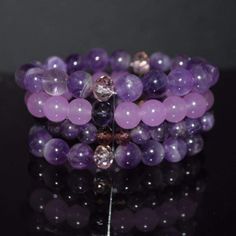 A unique two color of gemstone and jade beaded stretch bracelets. Multiple strands purple beaded women's bracelets with 10mm Amethyst crystal beads. Amethyst, a stone traditionally worn to guard against drunkenness and to instill a sober mind. Carnelian is an agate class of chalcedony that is a stone of creativity, individuality, and courage. Like all agates, it has protection energies. {"@context":"https://schema.org/","@type":"Product","name":"Amethyst And Purple Carnelian Beaded Multi Strands Purple Crystal Bracelet, Amethyst Crystal Bracelet, Purple Beaded Bracelets, Beaded Braclets, Crystal Bead Jewelry, Purple Beaded, Purple Jade, Purple Bracelet, Purple Themes