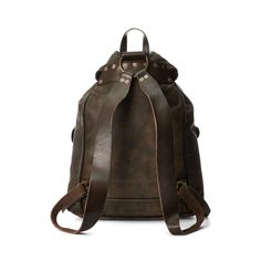 Iconic rucksack model made from lightweight supple buffalo hide. Vegetable-tanned cow leather trim. Specially hand-finished for a timeworn look. Brass hardware and distressed copper-tone rivets. Ralph Lauren Leather, Leather Rucksack, Lauren Brown, Buffalo Leather, Distressed Leather, Brass Hardware, Rivets, Leather Top, Cow Leather