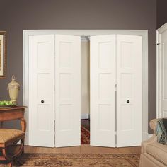 two white doors open in a living room