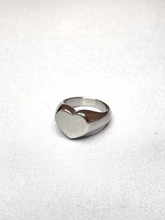 Heart ring made of stainless steel. No green fingers. Water safe. Tarnish free. Check out our work on Instagram: @eterno.studios Website: www.eternostudios.com Silver Heart-shaped Engraved Promise Ring, Trendy Silver Rings For Wedding, Minimalist Stainless Steel Signet Ring For Promise, Minimalist Stainless Steel Signet Promise Ring, Trendy Silver Heart Ring For Valentine's Day, Stainless Steel Promise Rings For Valentine's Day, Stainless Steel Ring With Polished Finish For Promise, Silver Heart Shaped Promise Signet Ring, Silver Heart Shaped Metal Ring