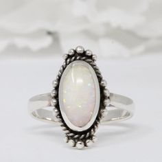 ☉ Metal Type: Sterling Silver. ☉ Metal Stamp or Hallmark: .925 ☉ Metal Purity: 92.5% Sterling. ☉ Finish: Oxidized ☉ Stone: White Lab Opal ☉ Face Measurements From South To North: 11.4mm Custom orders welcome! Oval Opal Promise Ring, Classic Handmade Oval Moonstone Ring, Classic Handmade Opal Ring, Sterling Silver Oval Opal Cabochon Ring, Oval Cabochon Opal Ring In Sterling Silver, Classic Silver Opal Ring Oval Cabochon, Vintage Silver Opal Ring With Oval Shape, Vintage Silver Oval Opal Ring, Classic Oval Opal Ring