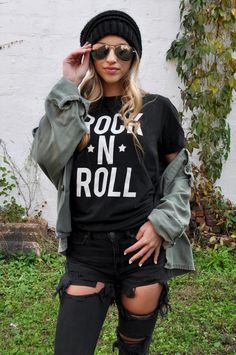 **Item Details** Made for all those Rock-N-Roll Souls out there! Give into your inner 90's grungy goddess and pair this Rock*N*Roll Tee with your favorite jeans, sneakers, and flannel for an extra layer of grunge! Graphic is printed on super soft Unisex Gildan black t-shirt.  For the trendy 'Oversized/Boyfriend' look size up 1 or 2 sizes, check the size guide in photos for more information! Gilden Unisex Black T-shirt: * 100% ringspun cotton * 4.5 oz/y² (153 g/m²) * Pre-shrunk * Shoulder-to-shoulder taping * Quarter-turned to avoid crease down the center *See Photos for Size Guide and Measurements* This design comes in a super cozy Crewneck Sweatshirt, link below : https://www.etsy.com/listing/1599536617/rock-n-roll-crewneck-sweatshirt-rocker?click_key=27673de41cb4e3819af55cd34929c856294f3 Rock And Roll Aesthetic, Rocker Chic Outfit, Boyfriend Look, Fall Graphic, Concert Fashion, Dinner Outfit, Rock Tees, Rocker Chic, Rock Chic