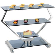 three tiered glass display case with cupcakes on the top and bottom shelf