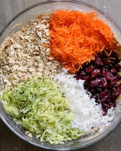 the ingredients for this salad are in a glass bowl on top of a wooden table