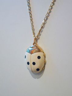 "These fabulous Ladybug Vintage Pendants are so much fun and just adorable! Very popular in the 1970's. Measurement: 2\" x 1.5\", hangs from a 24\" vintage chain. Also in green, ivory colored resin and tortoise color. **Please note: Ladybug dots show some aging." Vintage Enamel Necklaces With Lobster Clasp, White Vintage Necklace With Charm, White Vintage Necklace With Vintage Charm, Vintage Nickel-free Enamel Necklaces, Vintage White Necklaces, White Vintage Necklace For Vintage Collection, White Vintage Necklace, Vintage White Enamel Necklaces, White Retro Enamel Jewelry