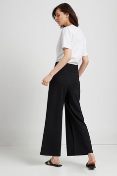 Relaxed. Versatile. Inspired by NYC life. You'll love our Nylah Pants. They're fashioned from structured, mid-stretch European ponte with a relaxed fit and a broad elasticized waistband. Two pockets line the front, another the back. Designed for those of us who like to keep it loose, these flowy, wide-legged pants will add polish to your look without sacrificing comfort. [SPLIT] Julia is 5'10" (178 cm) tall, wearing size XS. Total length from below the waistband is approximately 38" (96 cm). Ins Versatile Wide Leg Pants For Business Casual With Pockets, Modern High Waist Pants With Welt Pockets, Versatile Wide Leg High Waist Pants For Elevated Casual, Elastane Trousers With Welt Pockets, Chic Wide Leg Pants For Elevated Casual Occasion, Fitted Wide-leg Bottoms For Elevated Casual Occasions, Chic Wide Leg Pants With Elastic Waistband For Work, Chic Wide Leg Pants For Work With Elastic Waistband, Chic Straight Pants With 4-way Stretch