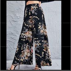 New Online Purchase In Original Packaging (So Has No Tags) But Has Never Been Worn. Black Floral High Waist Wide Leg Palazzo Pants Are So Lightweight And Look Amazing On! 100% Polyester Size Large (Us8-10) And Long. Has Zipper Closure In The Back Center. Pairs Great With Any Color Top; Flowers Are Grey, Pink, Red, And Golden Brown. Waist Measures About 15.5” Across When Laying Flat And The Inseam Is 28.5” Long. I Adore These Pants But Needed A Different Size So Immediately Bought Another Pair. T Black Bottoms With Floral Print For Spring, Fitted Black Printed Bottoms, Black High-waisted Wide Leg Pants For Spring, Black Printed Pants For Spring, Fitted Printed Black Bottoms, Casual Black Bottoms With Floral Print, High Waist Black Printed Bottoms, Black Printed Wide Leg Pants, Casual Black Floral Print Pants