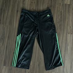 Adidas Green And Black Track Pants. Womens Size M. Cropped. New Without Tags! Drawstring Waist With Side Pockets. Polyester Material. Black Sports Capris For Spring, Black Capris For Sports In Spring, Black Athleisure Capri Bottoms, Black Sports Capris, Black Athleisure Capri Length Pants, Casual Black Capris For Sports, Black Track Pants, Adidas Joggers, Pants Womens