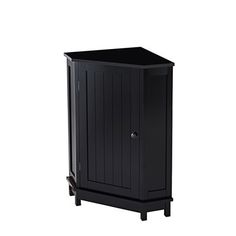 the small cabinet is black and has two doors on one side, and a drawer on the other