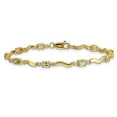 14k yellow gold and rhodium over 14k yellow gold fancy diamond and 2.250 cttw peridot bracelet. Measures approximately 1/8 of an inch in width and has a lobster claw closure. Yellow Gold Cubic Zirconia Jewelry With Accent Stones, Yellow Gold Jewelry With Accent Stones For May Birthstone, May Birthstone Yellow Gold Jewelry With Accent Stones, Gold Multi-stone Diamond Bracelet, Yellow 14k Gold Jewelry With Diamond Accents, Formal Peridot Jewelry For May Birthstone, Yellow Gold Diamond Bracelet With Gemstone Accents, Classic Gold Jewelry With Peridot, Elegant Multi-stone Yellow Gold Diamond Bracelet